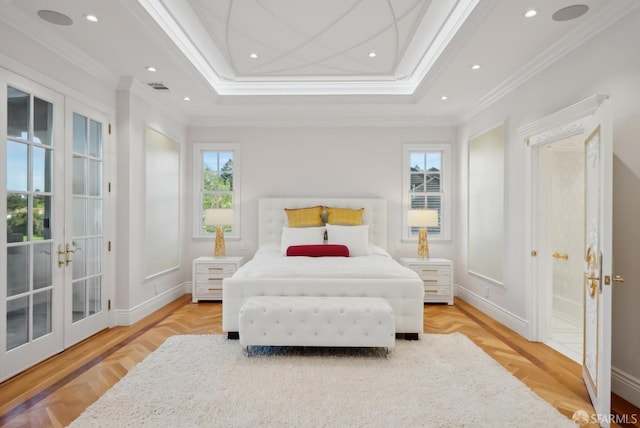 bedroom featuring french doors, a raised ceiling, ornamental molding, baseboards, and recessed lighting