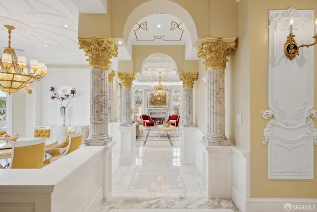 common area with a wainscoted wall, a decorative wall, recessed lighting, and crown molding