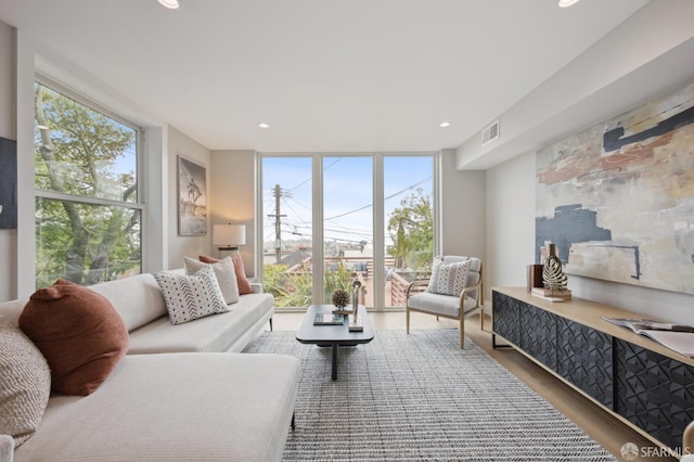 1983 15th Ave, San Francisco, CA 94116 - living room with a wall of windows, healthy amount of natural light, wood finished floors, and recessed lighting