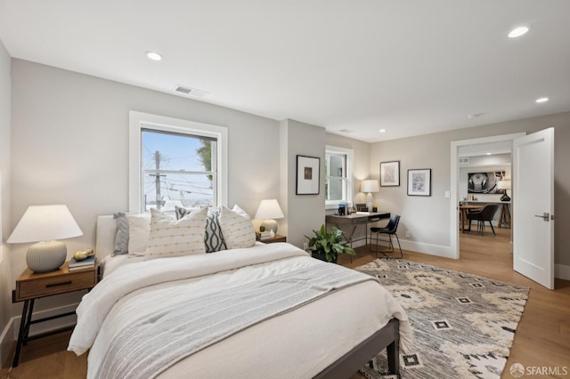 1983 15th Ave, San Francisco, CA 94116 - bedroom with recessed lighting, light wood-style flooring, and a desk