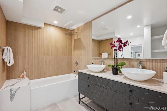 1983 15th Ave, San Francisco, CA 94116 - bathroom featuring bathing tub / shower combination, double vanity, tile walls, backsplash, and recessed lighting