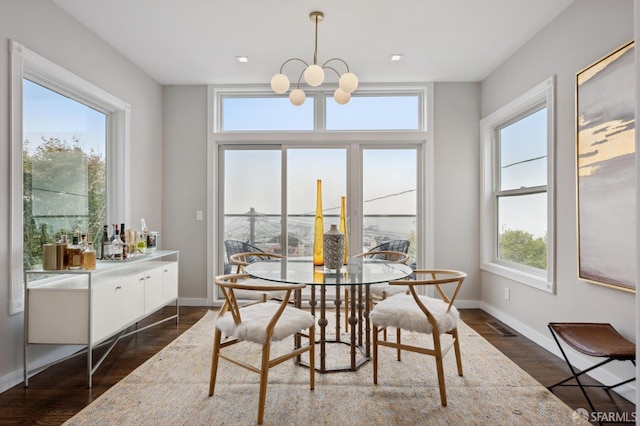 1983 15th Ave, San Francisco, CA 94116 - dining room with dark wood finished floors, a chandelier, and bar area