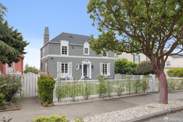 1983 15th Ave, San Francisco, CA 94116 - view of front of house featuring a chimney, a fenced front yard, and a gate