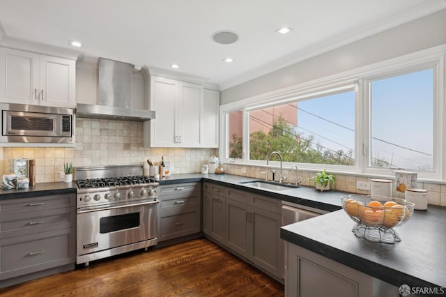 1983 15th Ave, San Francisco, CA 94116 - kitchen with appliances with stainless steel finishes, wall chimney exhaust hood, dark countertops, gray cabinets, and recessed lighting