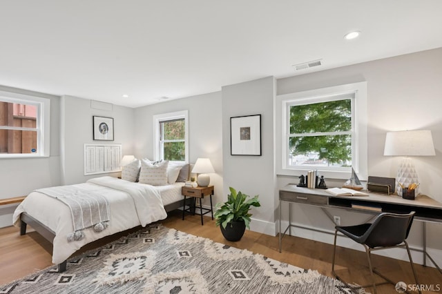 1983 15th Ave, San Francisco, CA 94116 - bedroom with wood finished floors and recessed lighting