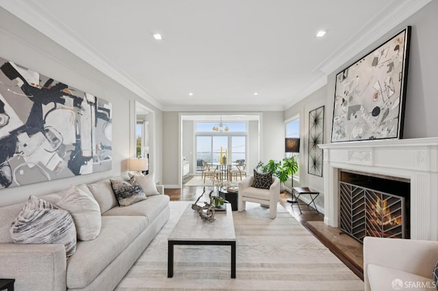 1983 15th Ave, San Francisco, CA 94116 - living area with ornamental molding, recessed lighting, a lit fireplace, wood finished floors, and a chandelier