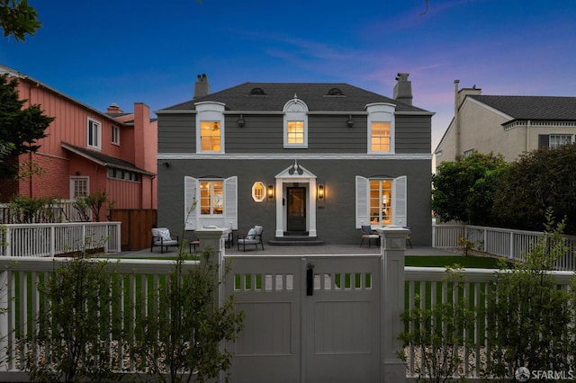 1983 15th Ave, San Francisco, CA 94116 - french country style house with a fenced front yard, covered porch, a chimney, and stucco siding