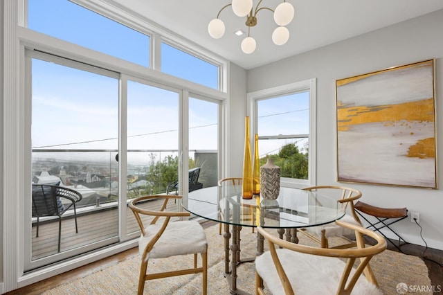 1983 15th Ave, San Francisco, CA 94116 - dining area featuring wood finished floors, healthy amount of natural light, and a chandelier