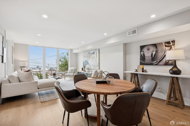 1983 15th Ave, San Francisco, CA 94116 - dining room featuring expansive windows, light wood-style floors, and recessed lighting
