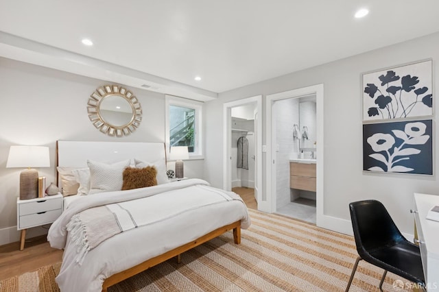 1983 15th Ave, San Francisco, CA 94116 - bedroom with recessed lighting, connected bathroom, and wood finished floors