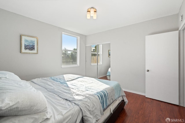 bedroom featuring dark hardwood / wood-style flooring