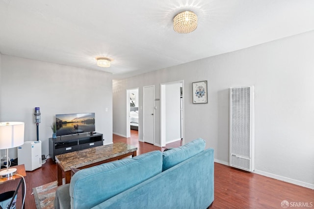 living room with dark hardwood / wood-style floors