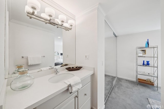 bathroom with ornamental molding, vanity, baseboards, and ensuite bathroom