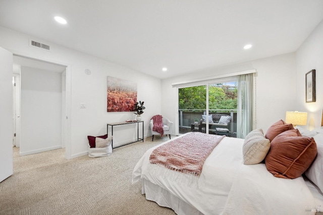 carpeted bedroom with access to outside