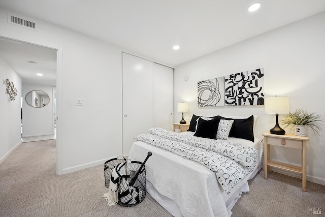 carpeted bedroom with a closet