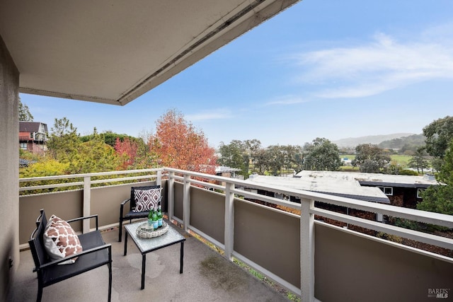 balcony featuring a mountain view