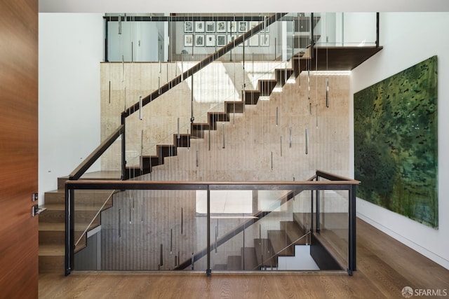 stairs with hardwood / wood-style flooring