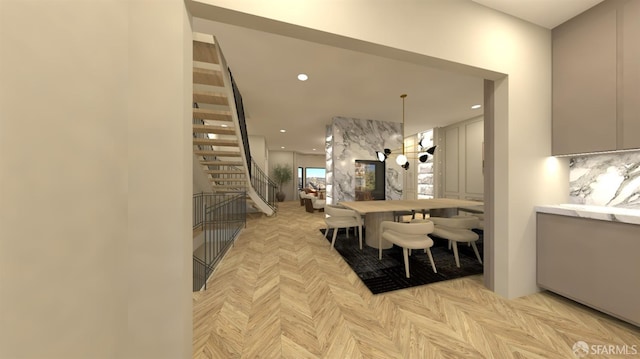 dining space featuring light parquet floors