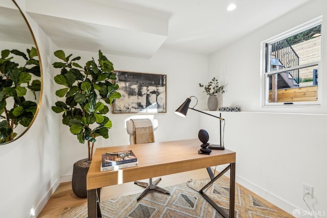 office space featuring recessed lighting, wood finished floors, and baseboards