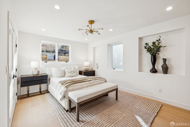 bedroom featuring recessed lighting, light wood-style flooring, and baseboards