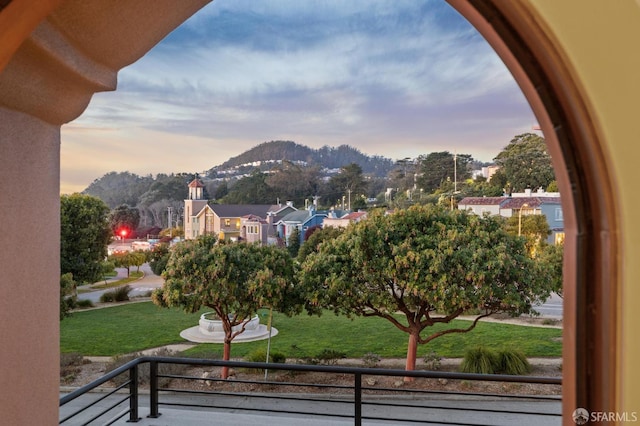 exterior space with a mountain view and a balcony