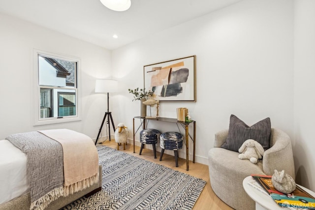 bedroom featuring recessed lighting, baseboards, and wood finished floors