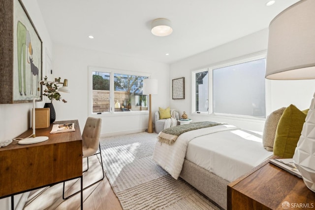 bedroom featuring baseboards and recessed lighting