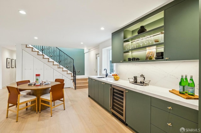 bar with decorative backsplash, wine cooler, stairway, a sink, and recessed lighting