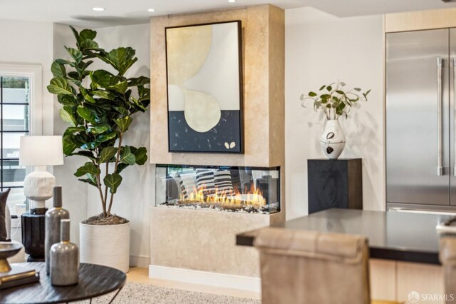 interior space with recessed lighting and a high end fireplace