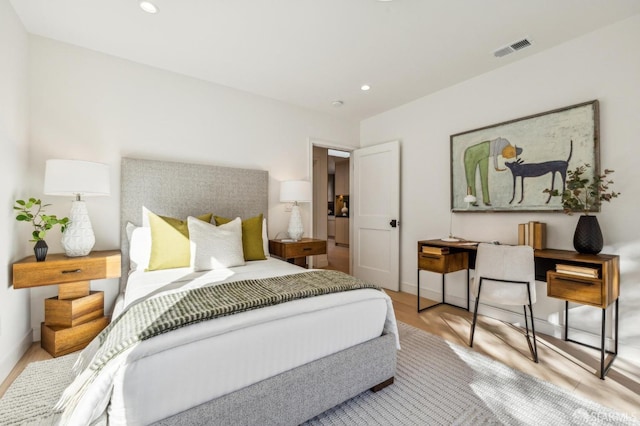 bedroom featuring recessed lighting, visible vents, baseboards, and wood finished floors