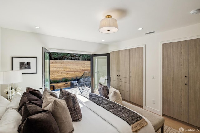 bedroom with access to exterior, visible vents, light wood finished floors, and recessed lighting