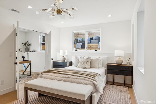 bedroom featuring baseboards, visible vents, a chandelier, and recessed lighting