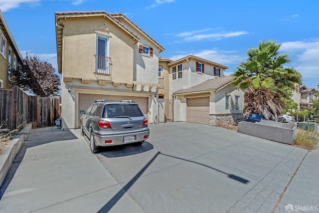 mediterranean / spanish home featuring a garage