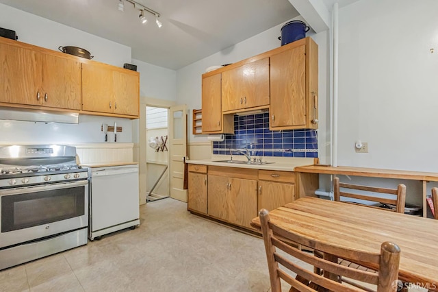 428 Monterey Blvd, San Francisco, CA 94127 - kitchen featuring stainless steel range with gas cooktop, under cabinet range hood, white dishwasher, backsplash, and light countertops