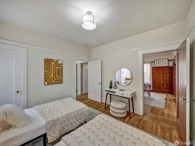 bedroom with hardwood / wood-style floors