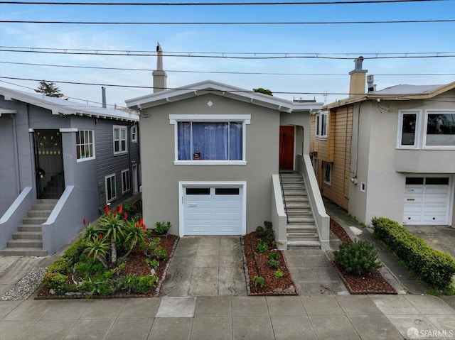 multi unit property featuring a garage