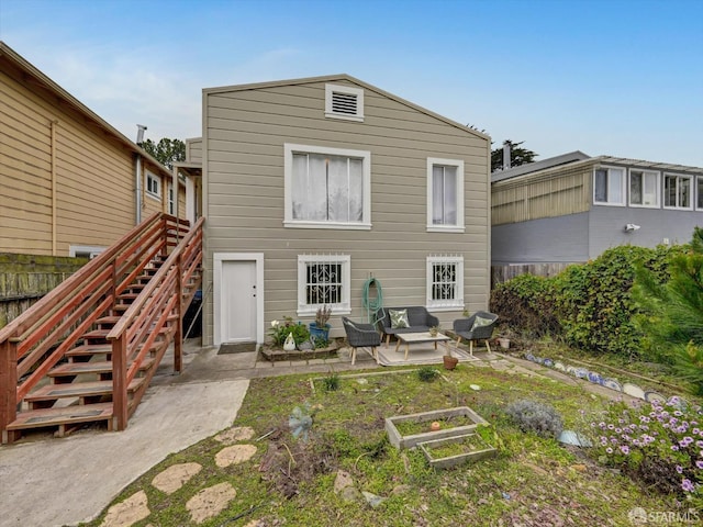 rear view of property featuring a patio area