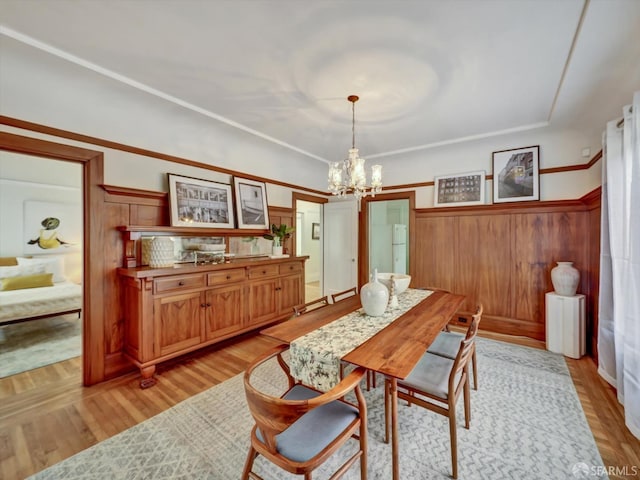 dining room featuring a chandelier and light hardwood / wood-style floors