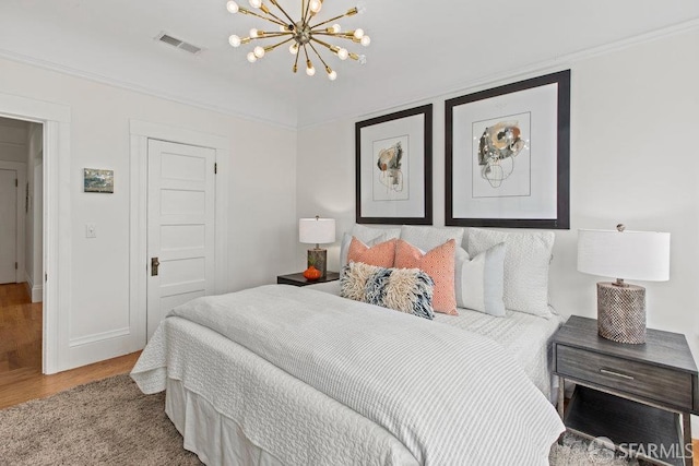 221 Noe St Unit 12, San Francisco, CA 94114 - bedroom with wood finished floors, a chandelier, and crown molding