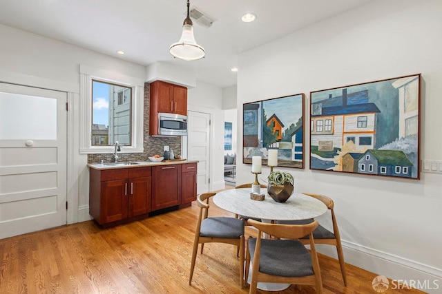 221 Noe St Unit 12, San Francisco, CA 94114 - dining space with light wood-style floors and recessed lighting