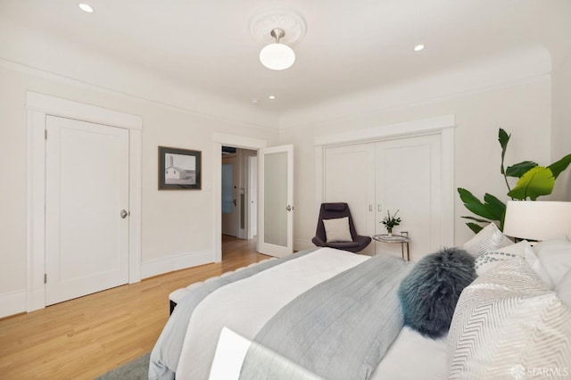 bedroom with a closet and wood-type flooring