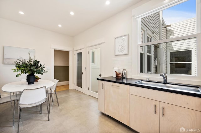 kitchen featuring sink and light brown cabinets