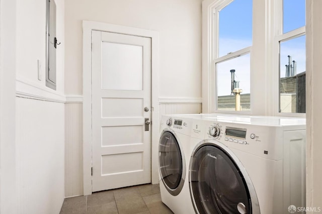 washroom featuring separate washer and dryer and light tile patterned floors