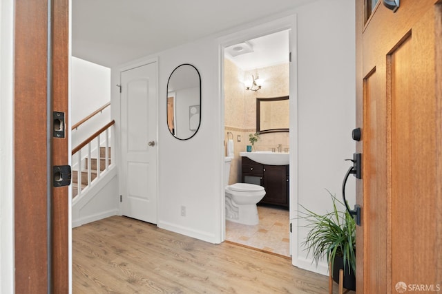 interior space with stairway and wood finished floors