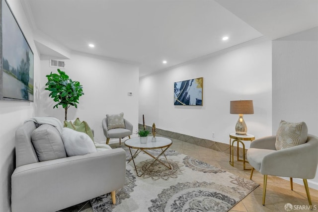 tiled living room with recessed lighting and visible vents