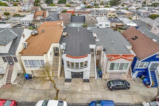 birds eye view of property with a residential view