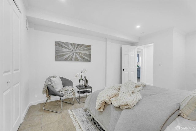 bedroom with light tile patterned floors, baseboards, and recessed lighting