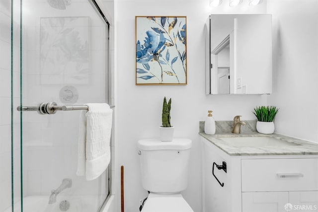 full bathroom featuring toilet and vanity