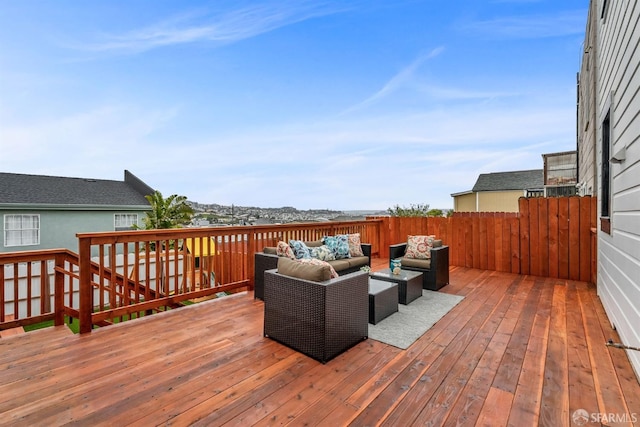 wooden terrace featuring an outdoor hangout area