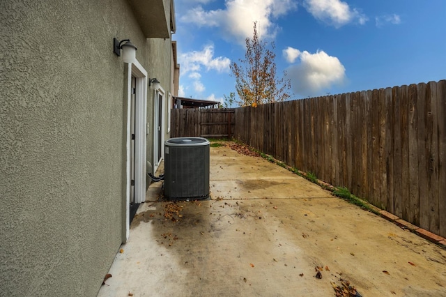 view of side of property featuring central AC